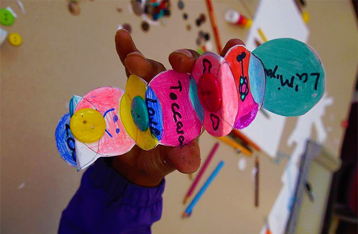 Accordion fold button book